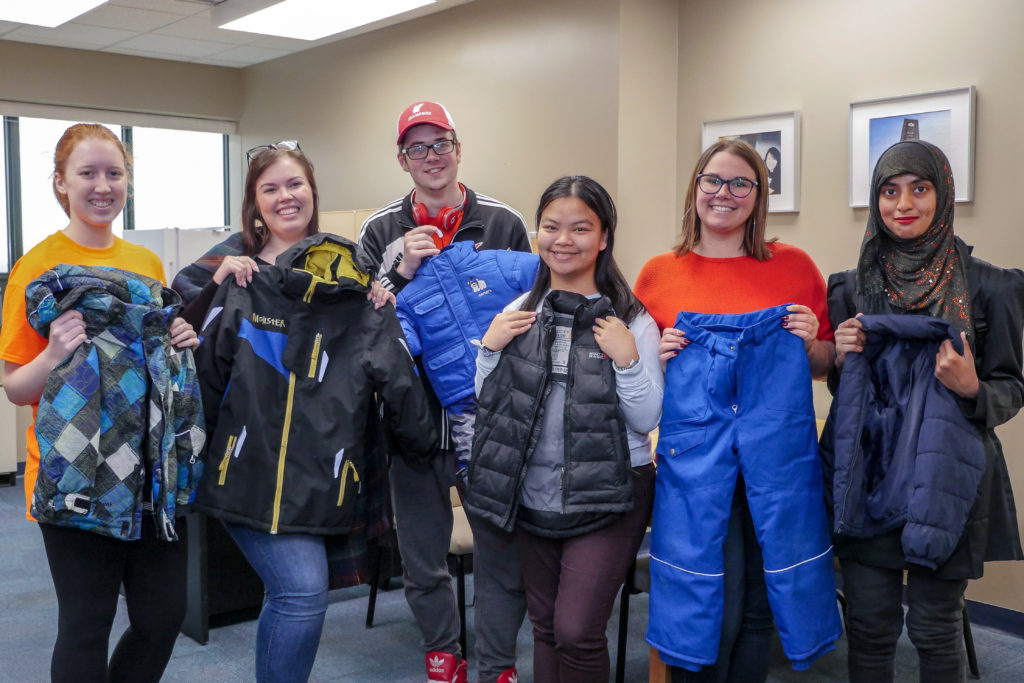 Memorial University students display some clothing they have collected as part of their Coats for Kids campaign.