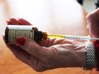 Mickie Pitcher, 77, of St. John's draws her regular dose of CBD oil with a syringe. Pitcher began taking CBD oil last year after experiencing the frightening symptoms of opiate withdrawal.