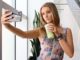 Local Instagram influencer Erin Kenny taking a selfie with her avocado smoothie.