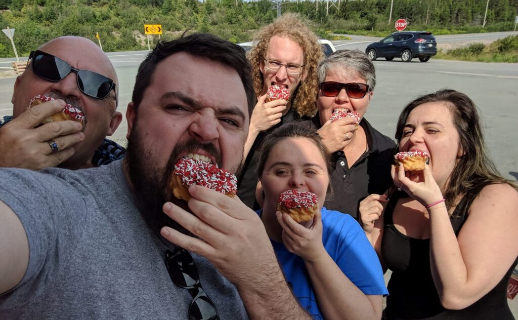 Sheila Bradbury and her family eating Special Olympics donuts.