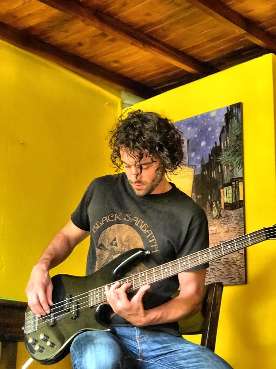 Francis Will plays bass at home in Newfoundland during lockdown, after returning from living in Montreal.