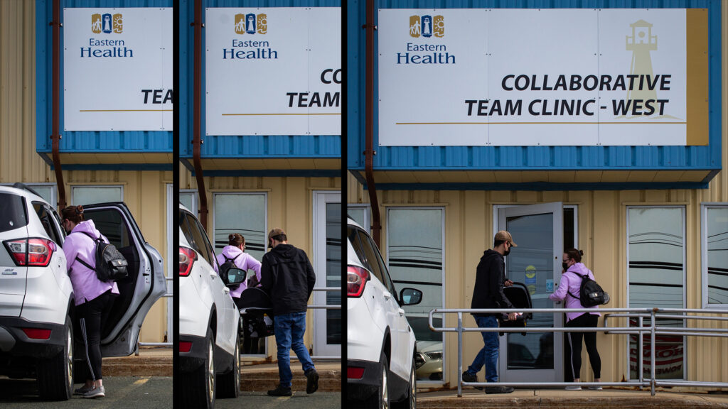 A couple carrying a baby enter a collaborative team clinic
