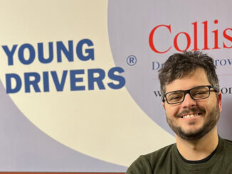 Nick Penney, a general manager at Young Drivers of Canada. Standing in front of a background with Young Drivers logo in the back.