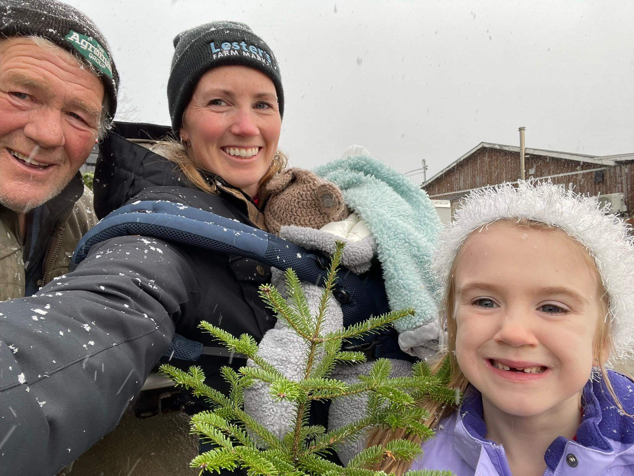 Three people take a selfie in the snow.