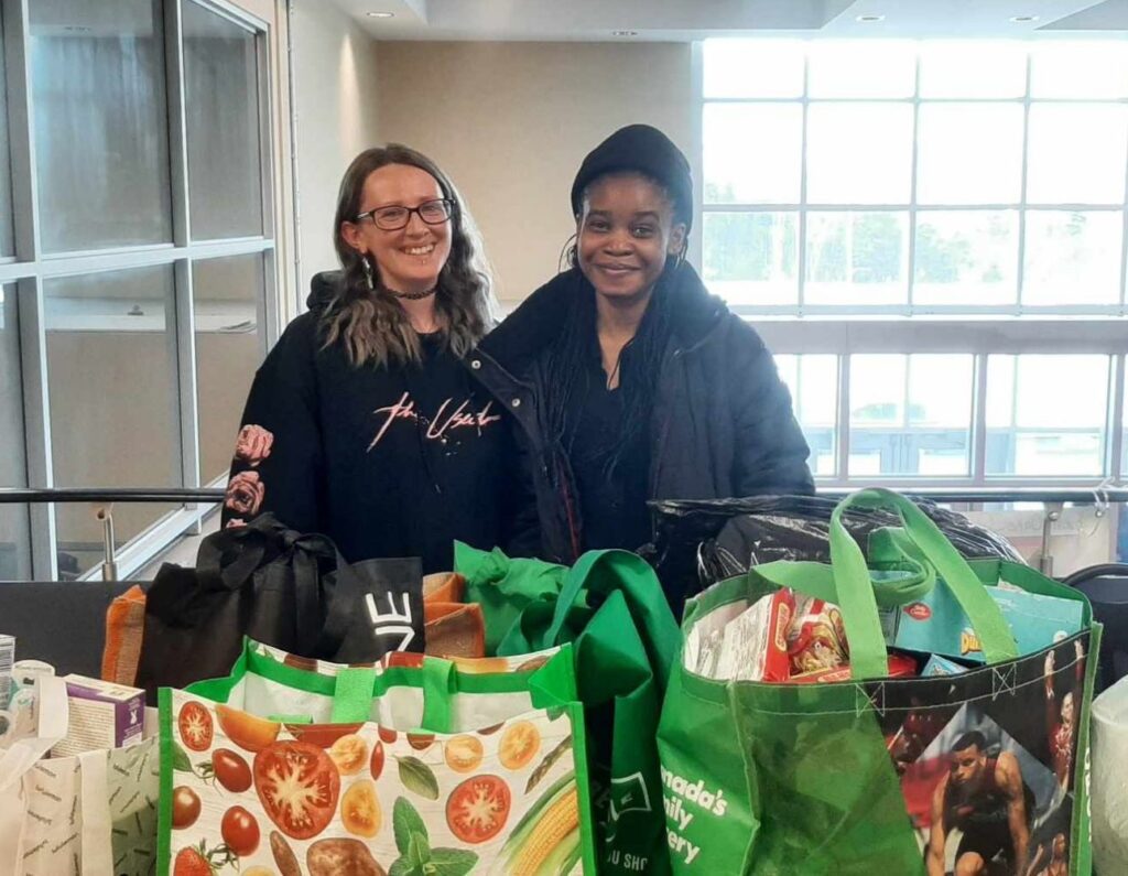 Alisha Noel (left) and Chinenye (right) are first-year medical office management students at Prince Philip Drive campus. They held a donation at the campus lobby on Tuesday afternoon, March 12 to gather daily needs to help single parents in need. Alisha Noel/CNA