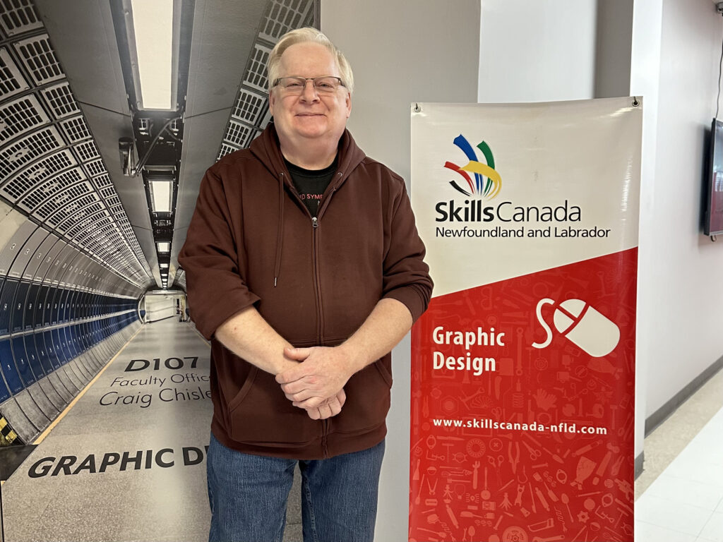 John Barry, a beacon of guidance at the College of the North Atlantic, stands proudly by the Skills Canada Newfoundland and Labrador banner, ready to inspire the next generation of graphic design talent. Mohamad Fuaz Khan/Kicker