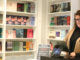 Rebecca Rose of breakwater books works in her shop