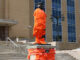 image shows John Cabot's statue in front of the confederation building wrapped in orange shirts and ties.
