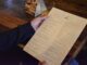 A customer at Cojones on Water Street reviews the menu. Cojones sales were down this August compared to the previous year even with the Canada games.