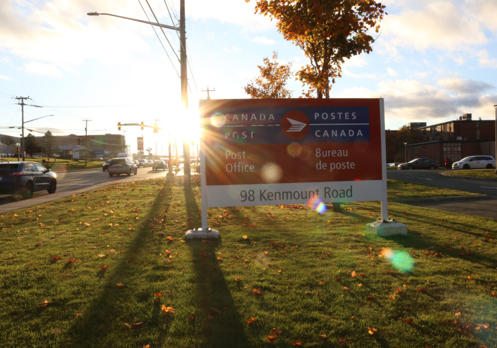 A sun sets over Canada Post on Kenmount Road.